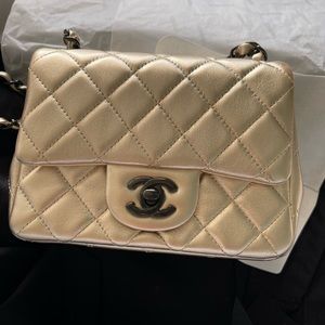 Brand new Chanel mini square bag in metallic gold with so black hardware